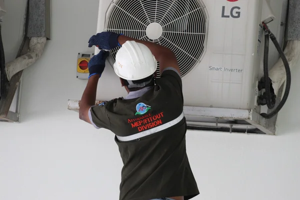 AC maintenance technician working in Dubai home